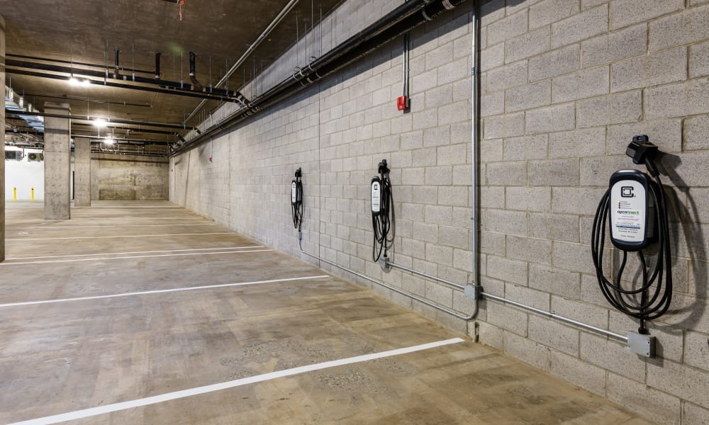 EV charging in a covered garage at 16 Powerhouse Apartments in Sacramento, California
