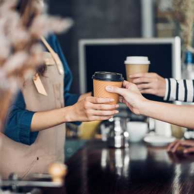 Friends buying coffee near Anchor Apartments in Freeport, Florida, 