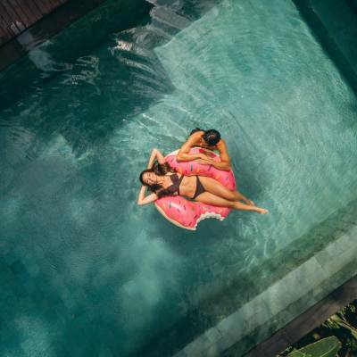 Resident enjoying in the pool at Anchor Apartments in Freeport, Florida, 