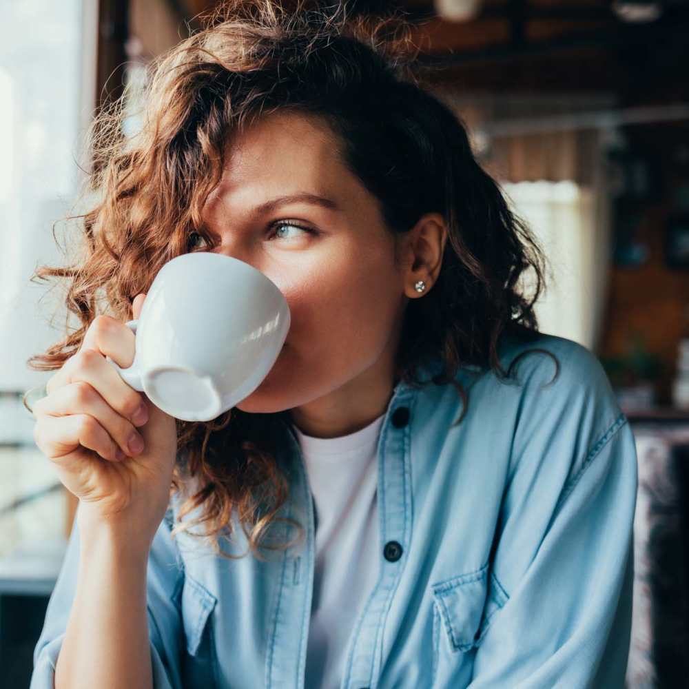 Resident having coffee near Perry Acres Apartments in New Haven, Michigan