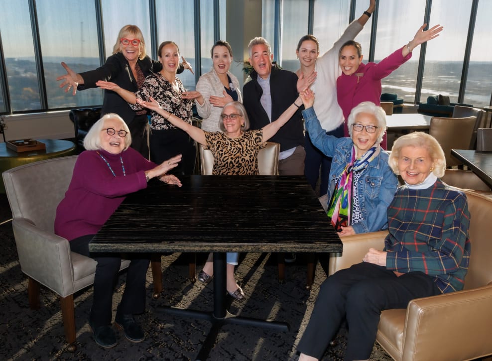 Residents and team members cheering together at Murano in Seattle, Washington