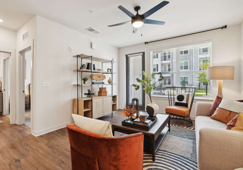 Stylish living room with neutral color palette at The Southerly at Orange City in Orange City, Florida