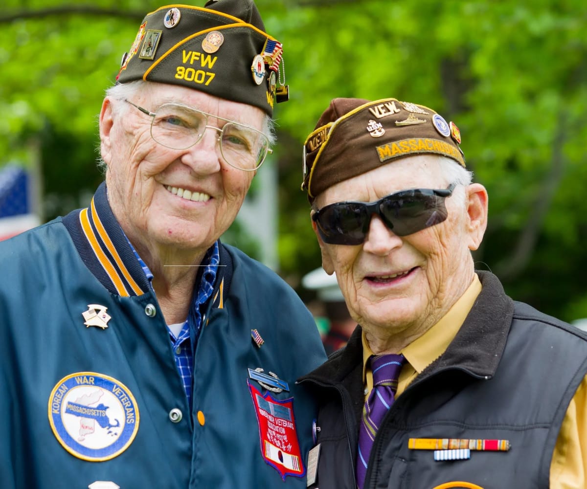 Veteran residents posing for a picture at Village on the Park Steeplechase in Houston, Texas