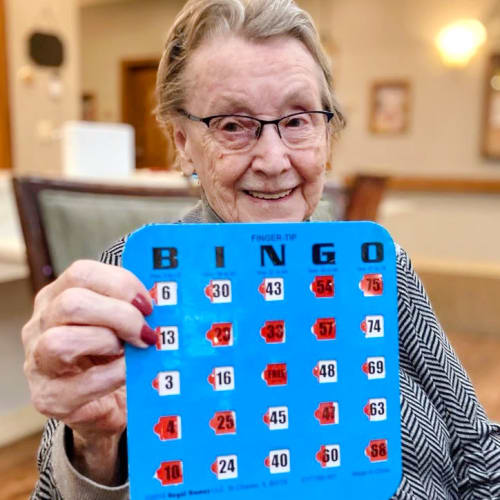 Resident playing bingo at Glen Carr House Memory Care in Derby, Kansas