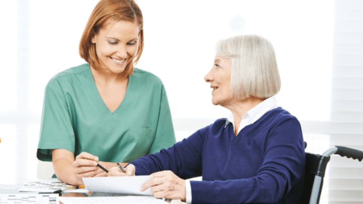 Two woman smiling each other