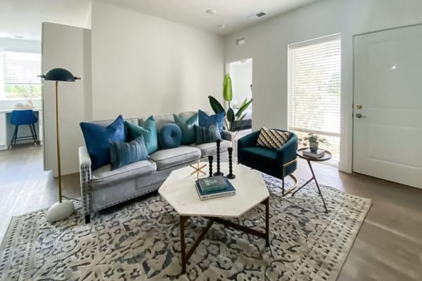 Sectional sofas with lots of pillows in a living room at Ravello 192 in Elkhorn, Nebraska