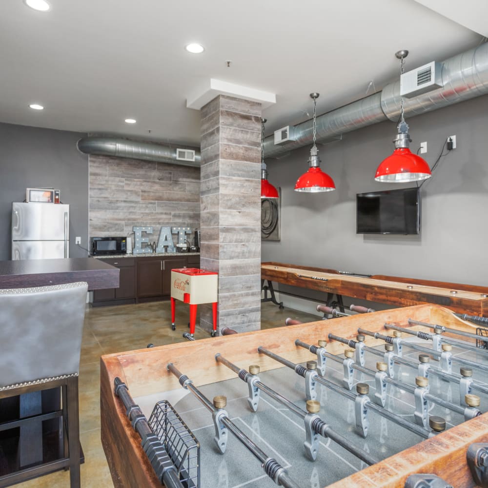 A foosball table and shuffleboard in the community clubhouse at Retreat at the Park in Burlington, North Carolina