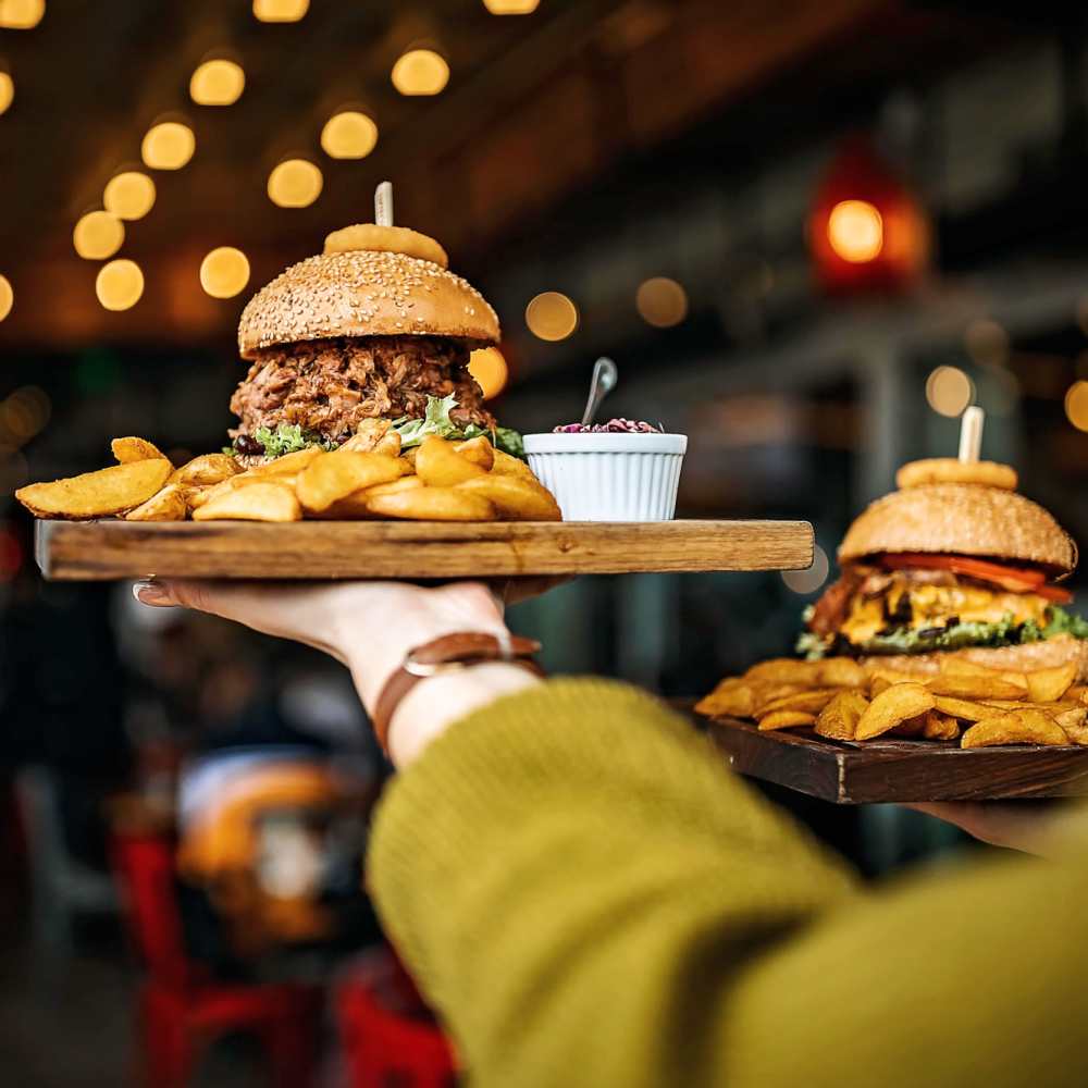 Burgers with fries on tray at Titan Court in Eugene, Oregon