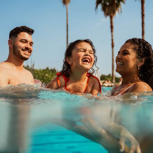 Resident family enjoying in the pool at Bellwood in Round Rock, Texas