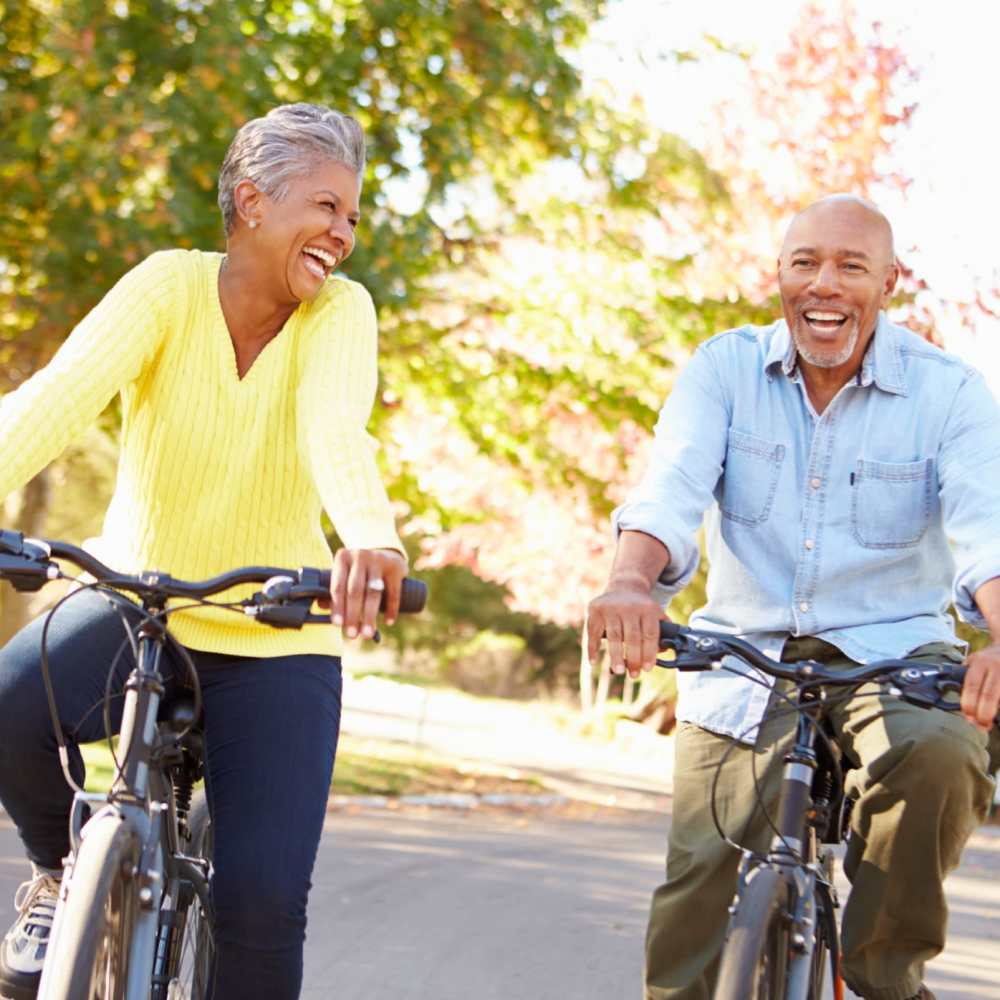 Resident riding bicycle in park near The Villas at Harbour Cove in Suffolk, Virginia