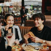 Resident friends out for a feast at their favorite restaurant near Cornell Midtown in Dallas, Texas