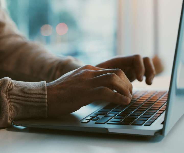 Resident working on a laptop at Beacon Place at Kentlands in Gaithersburg, Maryland