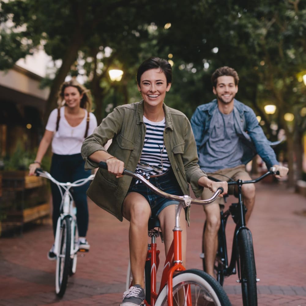 Group of happy residents riding bicycle at Crystal Springs in Fort Worth, Texas