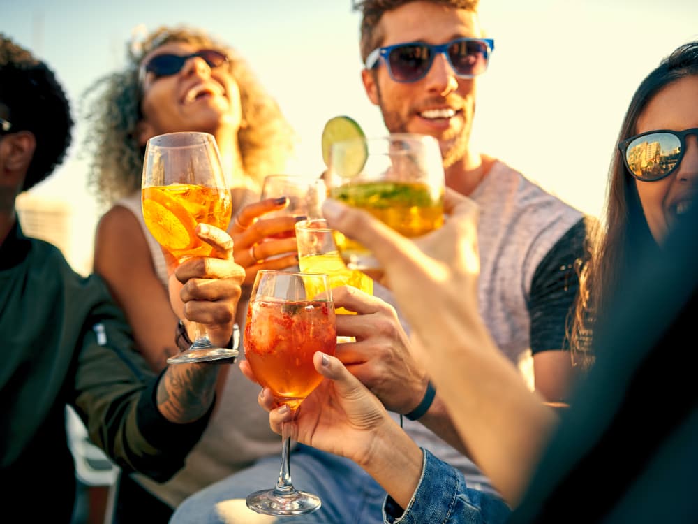 Residents toasting to a good time near Villa Vita Apartments in Peoria, Arizona