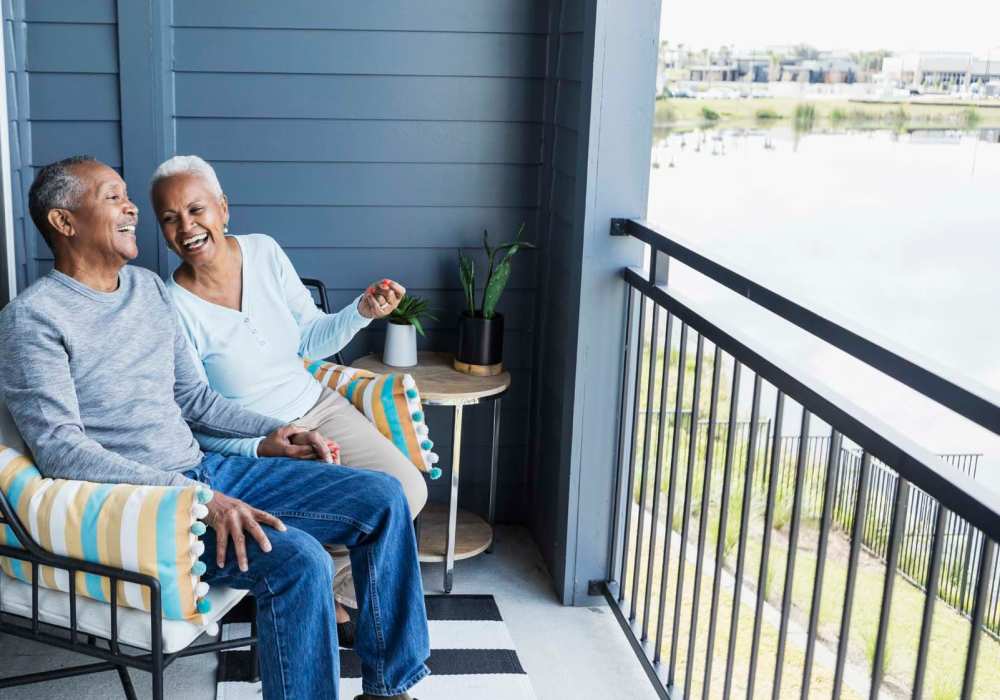 Happy couple in their private patio at Doria Apartments and Townhomes in Virginia Beach,Virginia