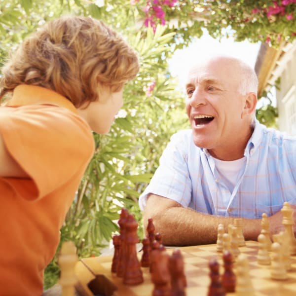 A man and his grandson playing chess at Monte Vista Village in Lemon Grove, California