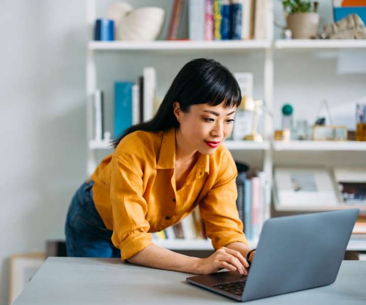 Resident working on her laptop at Acacia in Haltom City, Texas