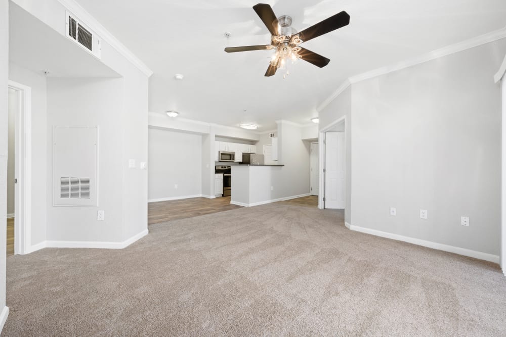 Living room with carpet at River Oaks Apartment Homes in Vacaville, California