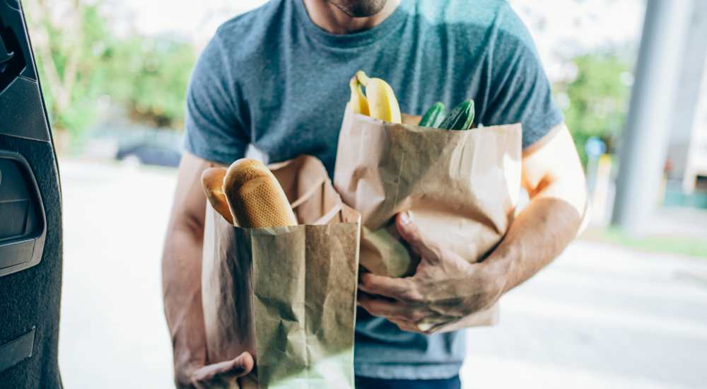 Resident with groceries near Beacon 430 in Saint Petersburg, Florida