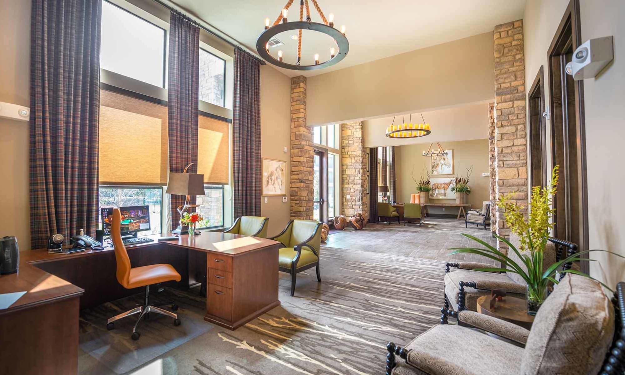 The Abbey at Spring Town Center leasing office interior with comfortable seating and beautiful decorations