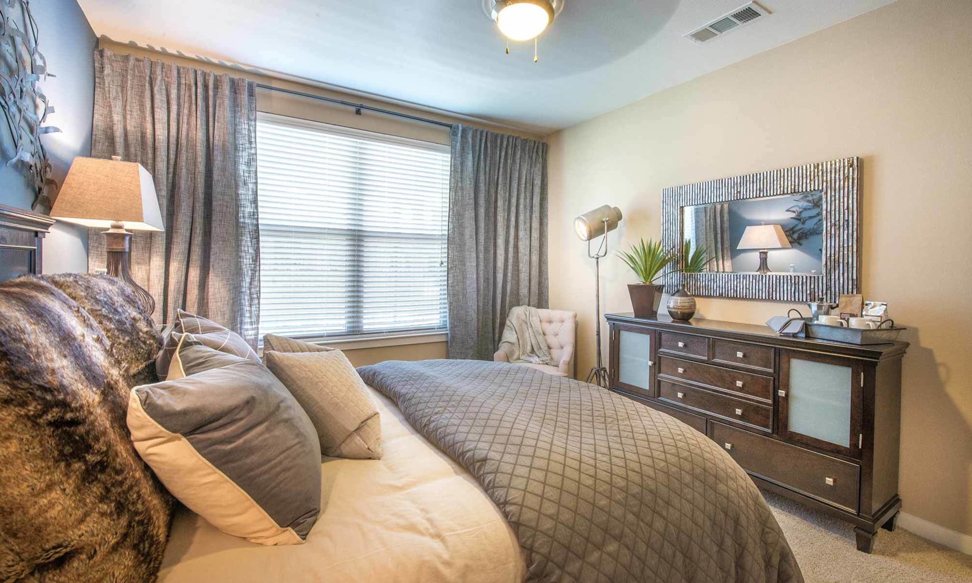 Spacious and well-decorated bedroom at The Abbey at Spring Town Center in Spring