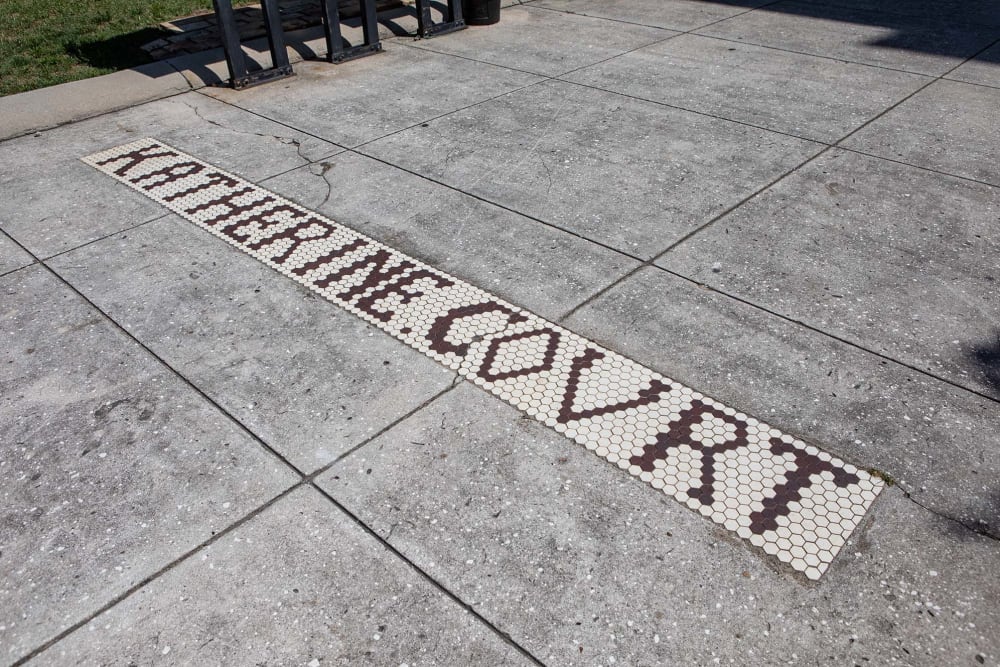 Community name in tile on the pathway outside at Katherine Courts in Macon, Georgia
