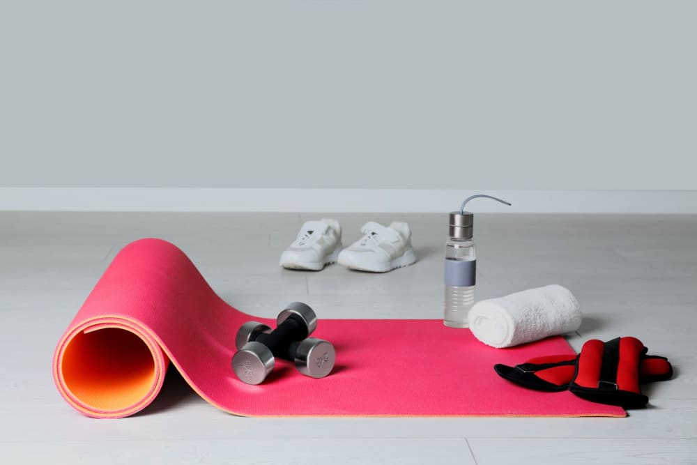 Workout sets that include shoes, raise weights, and yoga mat at Bella on Canyon in Puyallup, Washington