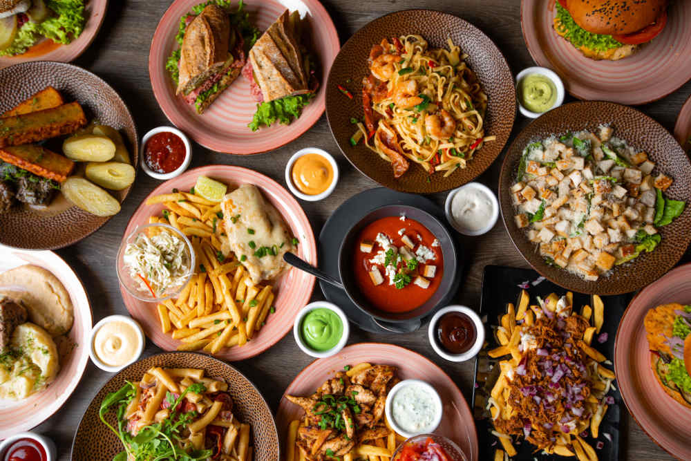 A table full of plates of food in a restaurant near Copper Ridge in Kennewick, Washington