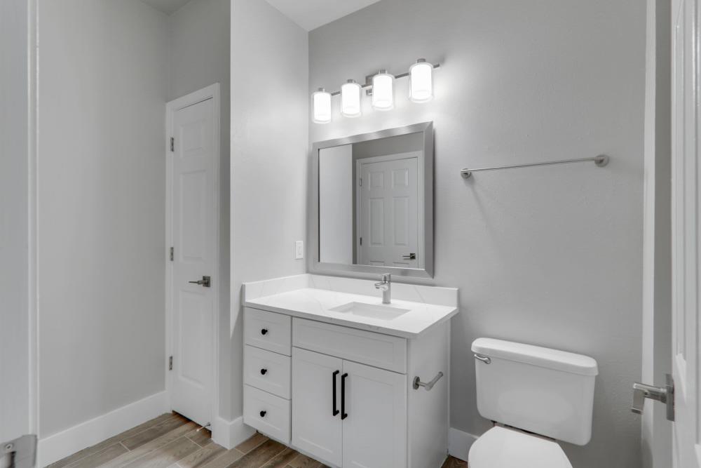 Bright bathroom with mirror at Wesley in Raleigh, North Carolina