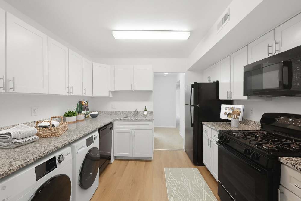 Bright kitchen with white cabinetry at Fairway Apartments in Reston, Virginia