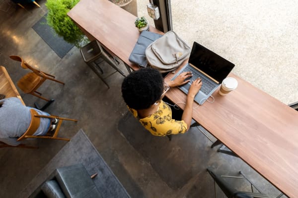 Resident working from a coffee shop near at Isles in Roseville, California