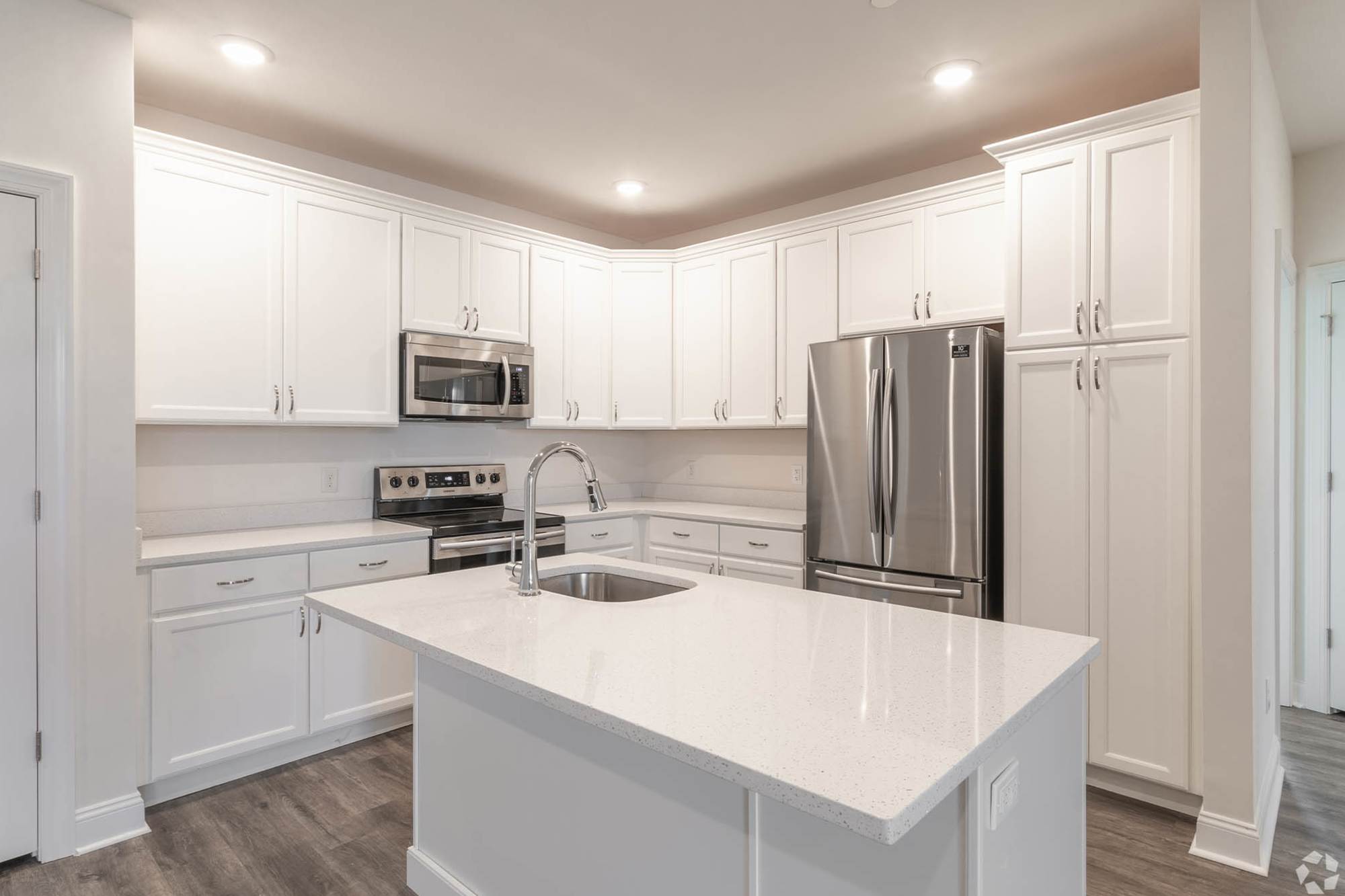 Model kitchen with white cabinets at The Residences at St. Joseph Court, Levittown, Pennsylvania