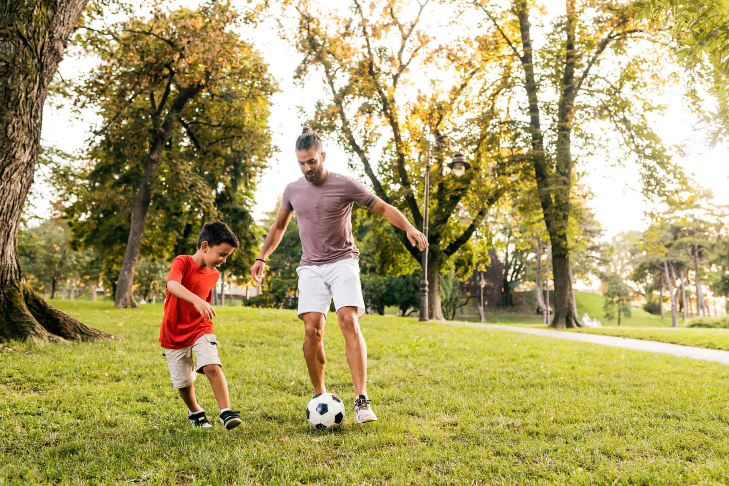 Resident with his son playing in the community at Stonegate Square in Midlothian, Texas