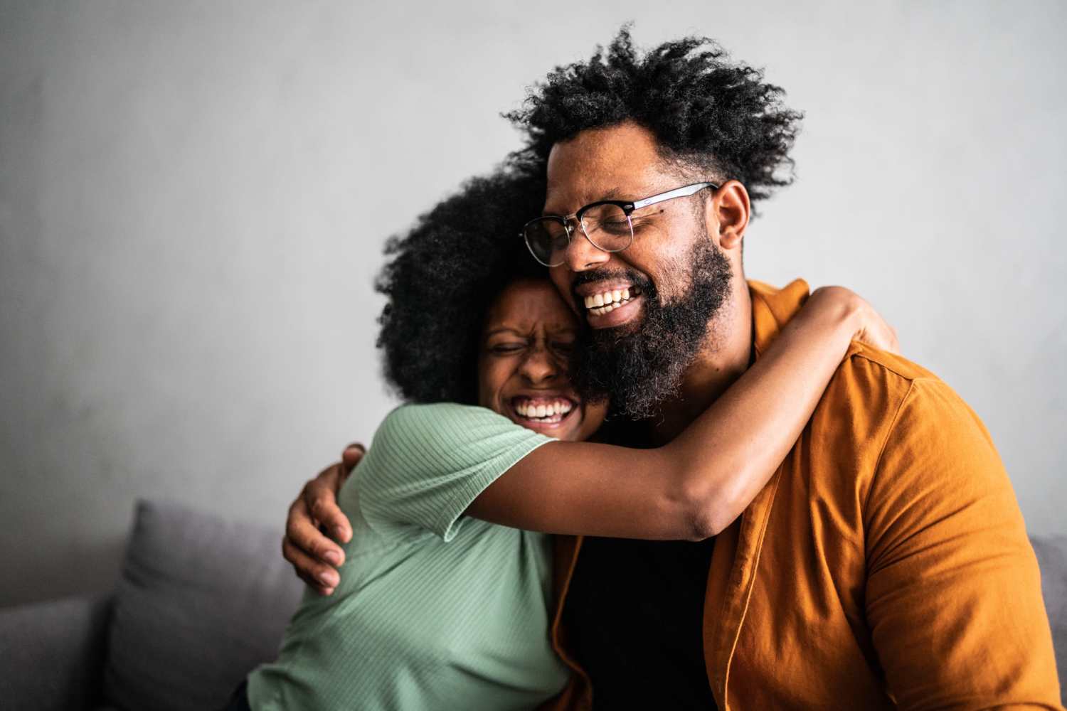 A happy resident couple in their apartment home at Woodstock Square in Joshua, Texas