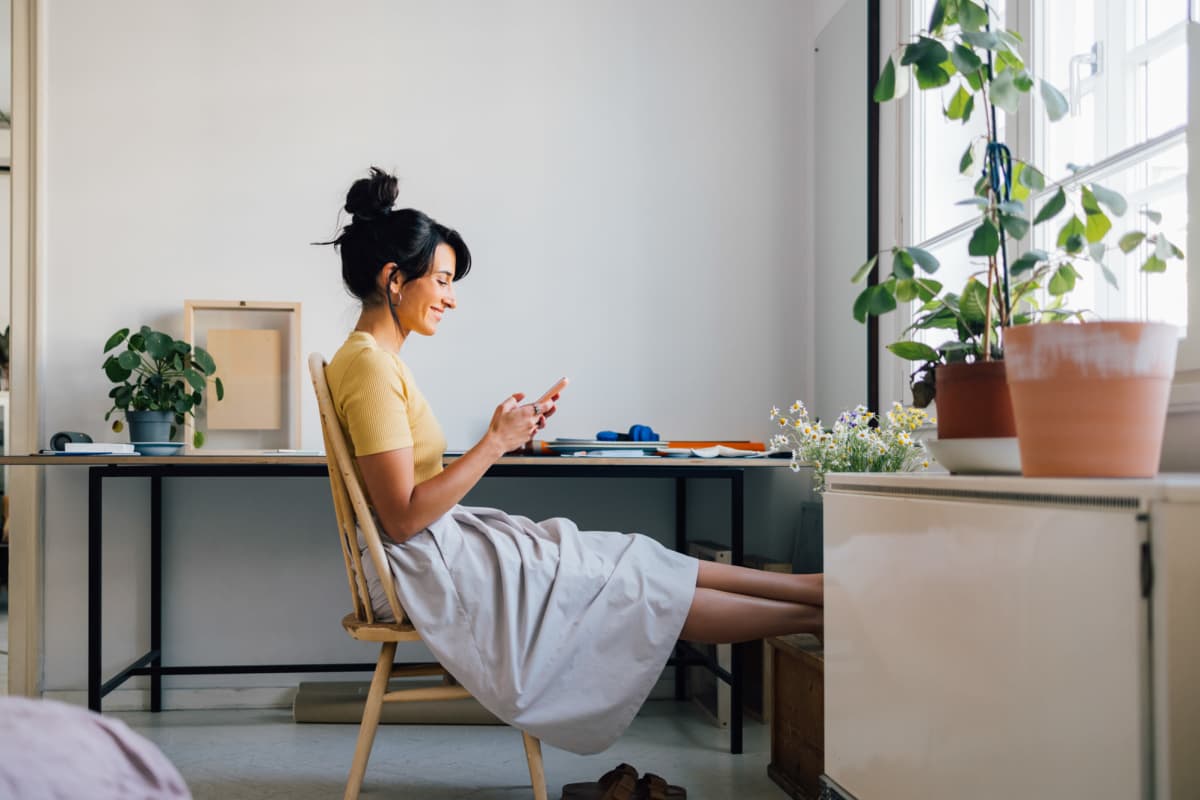  Resident using her phone at Tenants Development Corporation III, LP in Boston, Massachusetts