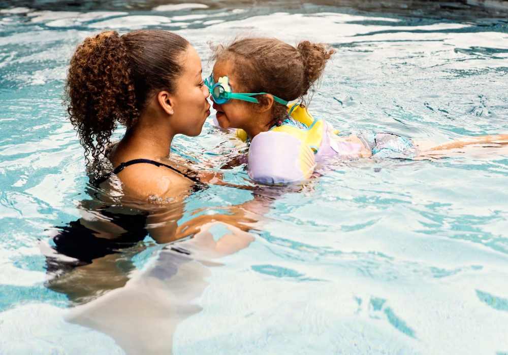 Mother and daughter in the pool at Walnut Apartments in Santa Rosa, California