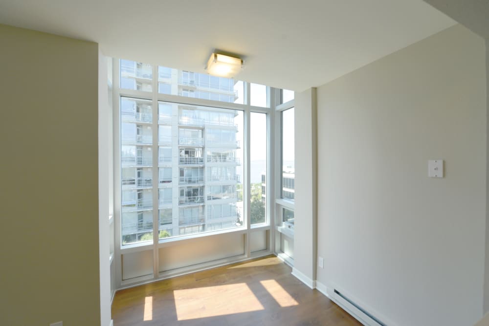 Apartment with large window and city view at 2900 on First Apartments in Seattle, Washington