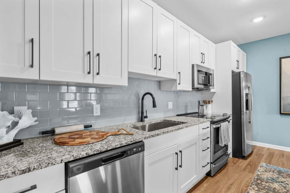 Classy kitchen with stainless-steel appliances and white cabinetry at North Bay Landing in Panama City,Florida