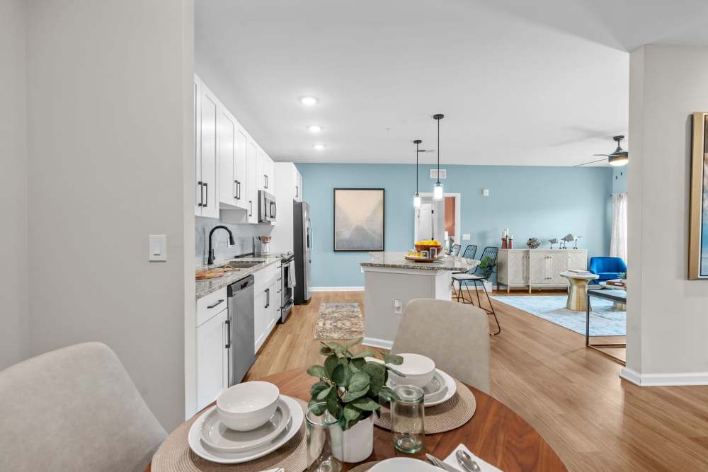 Apartment dining area with 4-seater dining table setup at North Bay Landing in Panama City,Florida