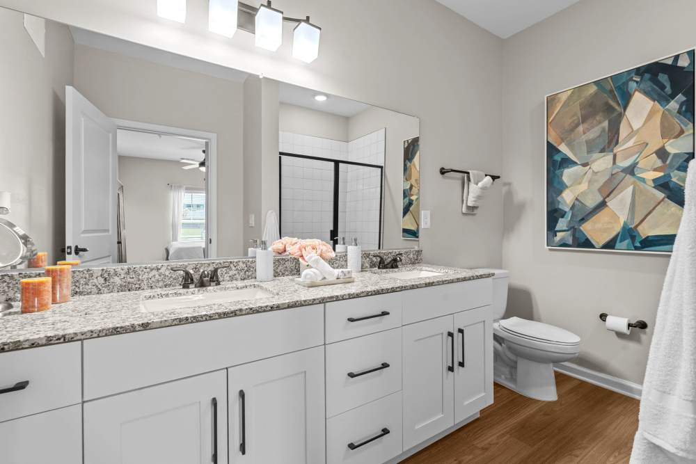Bathroom with hard flooring, waterfall faucet sink, and storage space at North Bay Landing in Panama City,Florida
