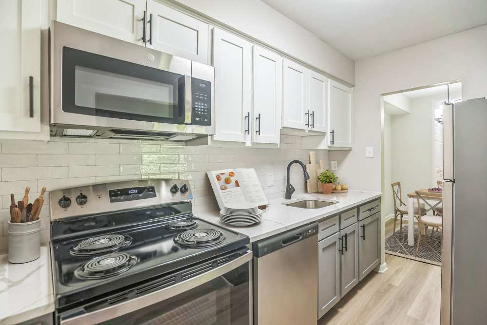 Kitchen with stainless steel appliances at Ramblewood Village Apartments in Mount Laurel, New Jersey