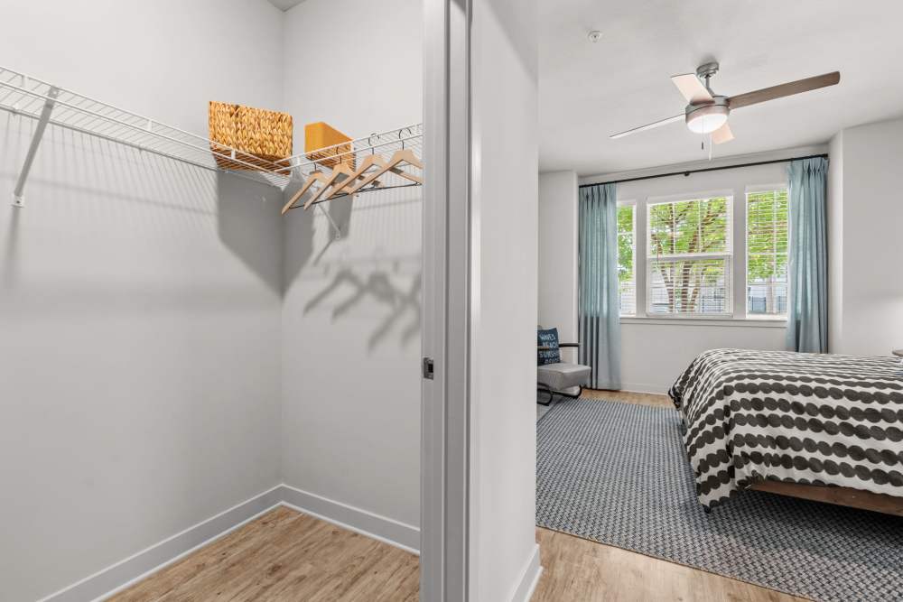 Guest bedroom apartment with large window and walk in closet at Pier Park Crossings Apartments in Panama City Beach.