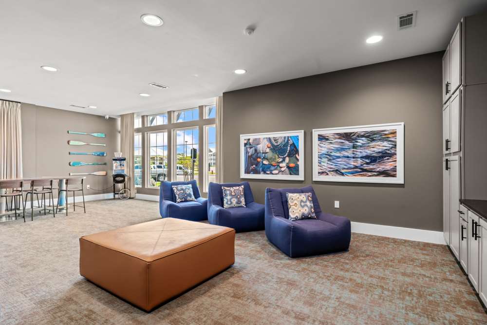 Community theater room with plush seating at Mexico Beach Crossings Apartments.