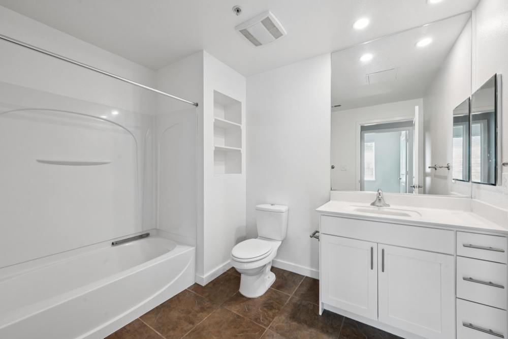 Modern Bathroom with white cabinetry and white counters at Azure Apartment Homes in Petaluma, California