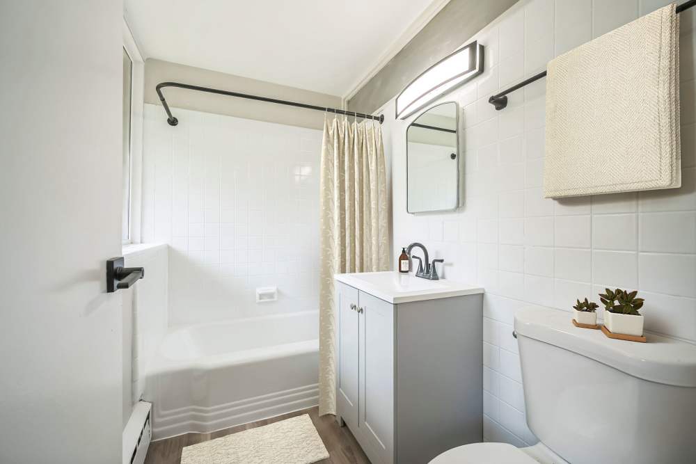 Newly renovated bathroom with tub at Cherokee Apartments in Philadelphia, Pennsylvania