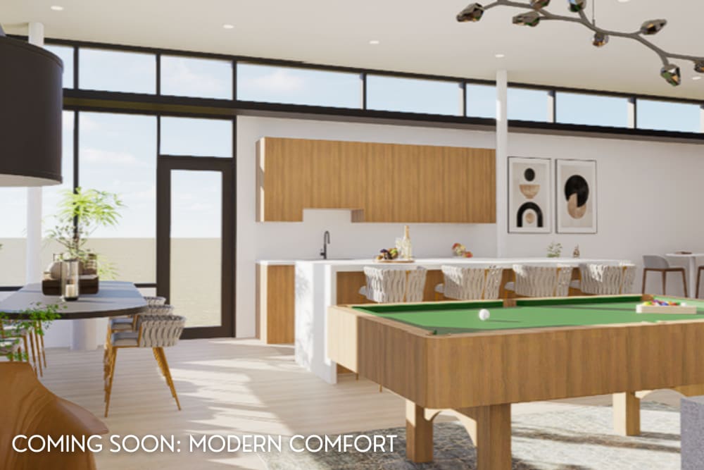 Renovated clubhouse with pool table, kitchen, and dining area, coming soon at Eagle Rock Apartments at Woodbury in Woodbury, New York