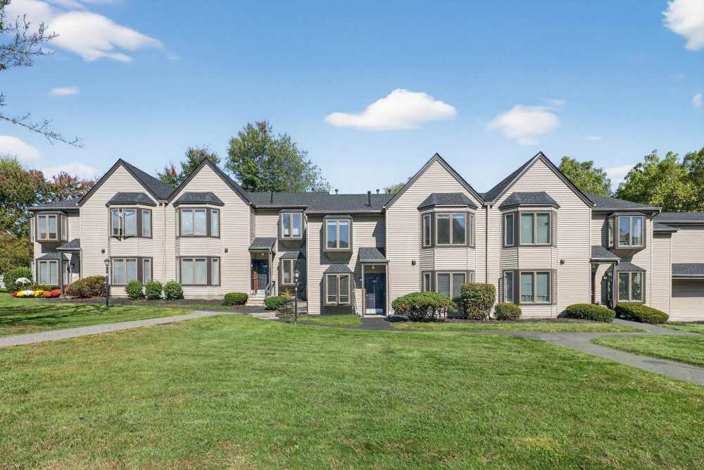 Outdoor Apartment View with Green Landscaping at Eagle Rock Apartments at Mohegan Lake in Mohegan Lake, New York