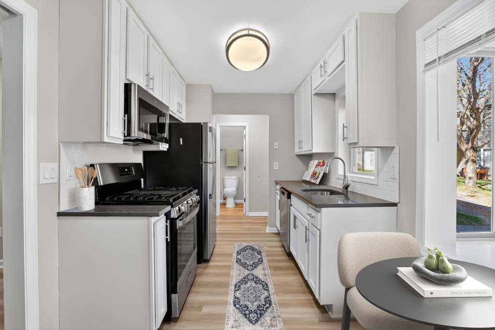 Kitchen with Dining Area View at Eagle Rock Apartments at Mohegan Lake in Mohegan Lake, New York