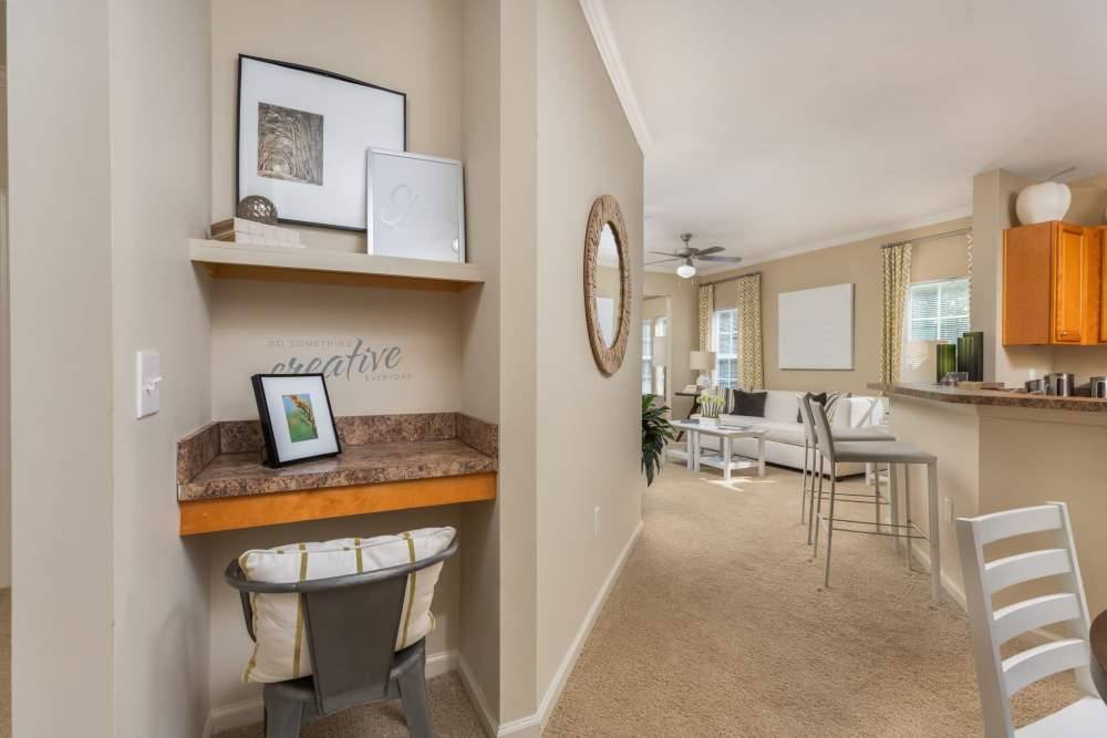 One bedroom apartment entry with computer nook and open floor plan to living room at Wembly at Overlook in Macon, GA.