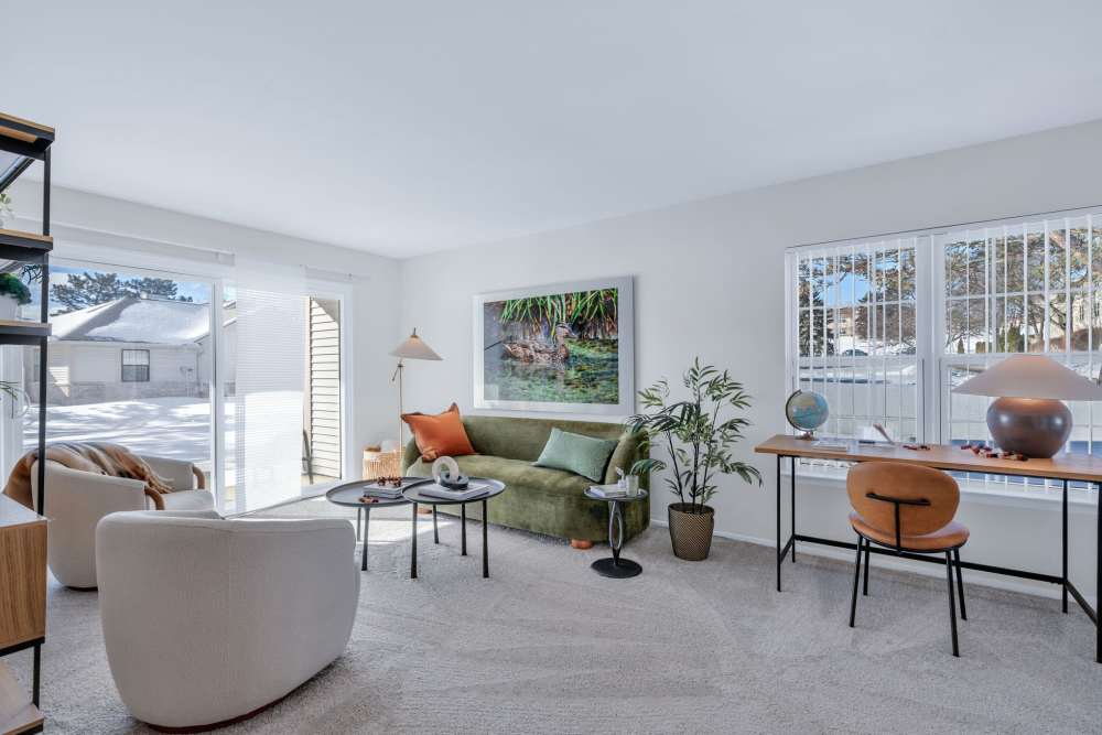 Living room opening onto a private balcony at Muirwood in Farmington Hills, Michigan